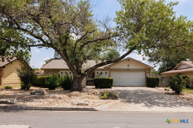 5006 Las Campanas St, San Antonio, TX 78233 - view of front facade featuring driveway and an attached garage