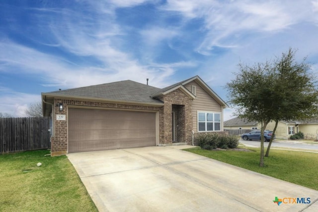 single story home featuring brick siding, concrete driveway, an attached garage, fence, and a front yard