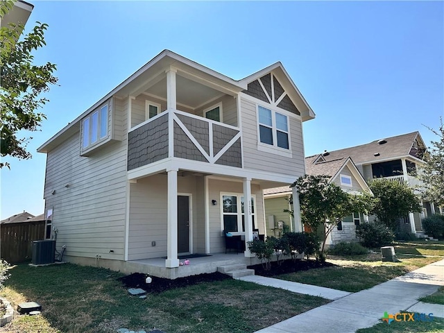 125 Duck Creek Trl, San Marcos, TX 78666 - view of front facade with covered porch, a balcony, central AC, and a front lawn