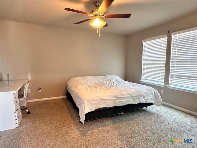 125 Duck Creek Trl, San Marcos, TX 78666 - bedroom featuring carpet, baseboards, and a ceiling fan