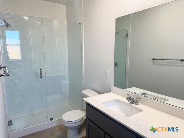 2310 Ocean Ave, Temple, TX 76501 - full bathroom with a shower stall, toilet, and vanity