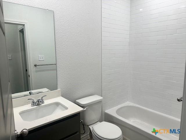 2310 Ocean Ave, Temple, TX 76501 - bathroom with tub / shower combination, a textured wall, toilet, and vanity