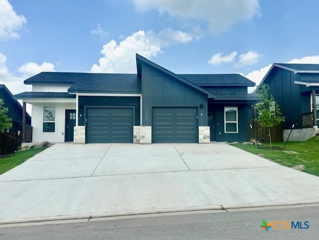 2310 Ocean Ave, Temple, TX 76501 - view of front of property featuring concrete driveway, a front lawn, roof with shingles, and a garage