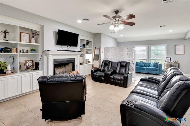 46 Bluestem St, Victoria, TX 77904 - living room featuring ceiling fan, built in features, light tile patterned floors, a fireplace, and recessed lighting