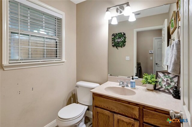 46 Bluestem St, Victoria, TX 77904 - half bath featuring toilet, vanity, and baseboards