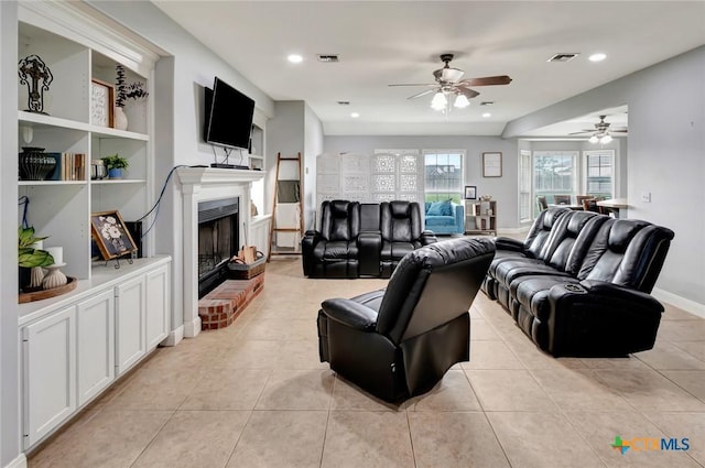 46 Bluestem St, Victoria, TX 77904 - living area featuring a ceiling fan, light tile patterned floors, a fireplace, recessed lighting, and baseboards