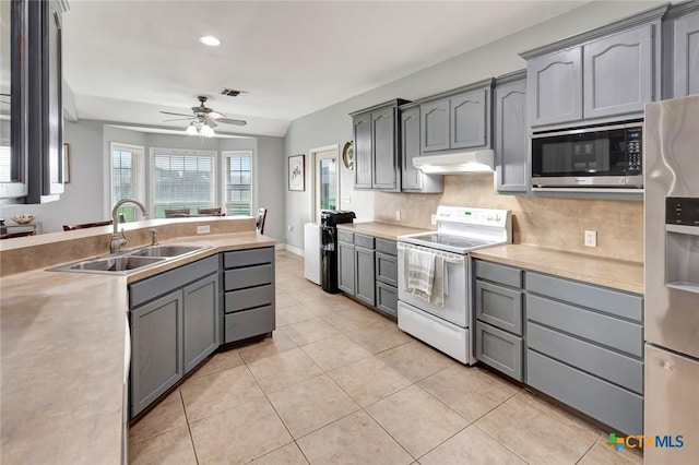 46 Bluestem St, Victoria, TX 77904 - kitchen featuring stainless steel appliances, a sink, under cabinet range hood, a ceiling fan, and gray cabinets