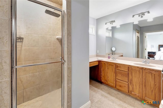 46 Bluestem St, Victoria, TX 77904 - bathroom with tile patterned flooring, a stall shower, double vanity, and connected bathroom