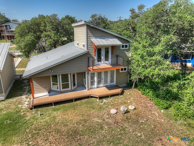 3055 Lakeview Dr, Canyon Lake, TX 78133 - back of property featuring french doors, a balcony, a yard, and a deck