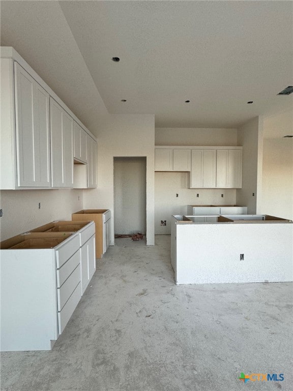 kitchen featuring white cabinetry and a kitchen island