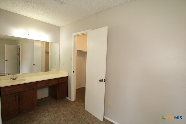 4508 Greenbriar Cir, Killeen, TX 76543 - bathroom with a textured ceiling, vanity, and baseboards