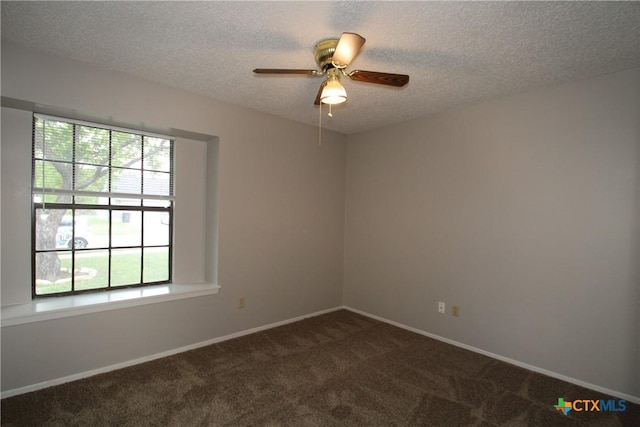 4508 Greenbriar Cir, Killeen, TX 76543 - unfurnished room with a textured ceiling, dark carpet, a ceiling fan, and baseboards