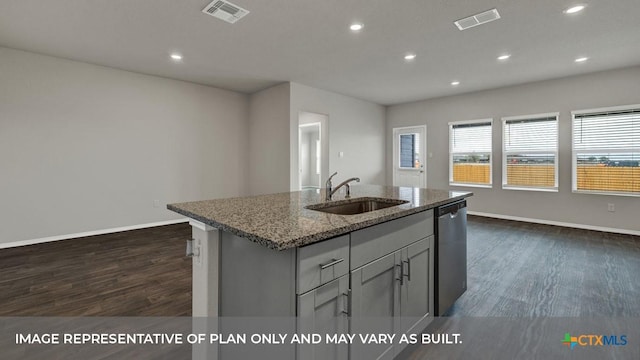 kitchen featuring stone countertops, dishwasher, sink, dark hardwood / wood-style flooring, and a kitchen island with sink