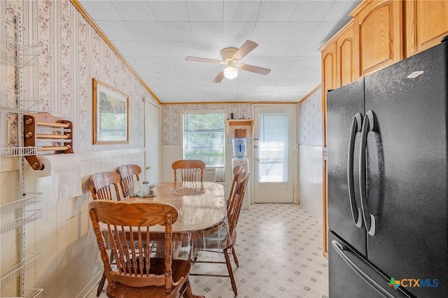 dining room with ceiling fan and ornamental molding