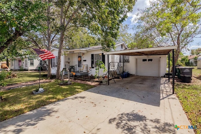 view of front of home featuring a front yard, a garage, and a carport