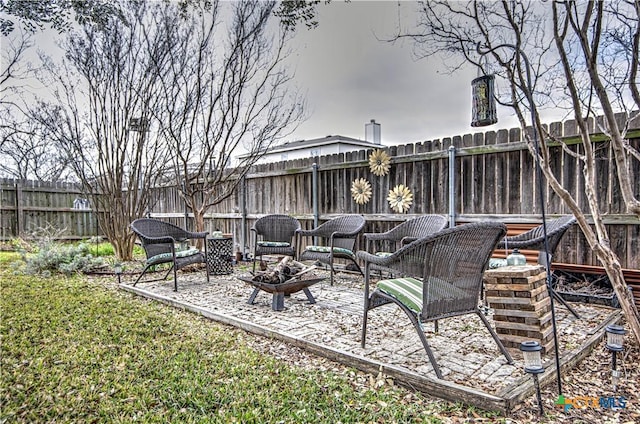 view of patio with an outdoor fire pit