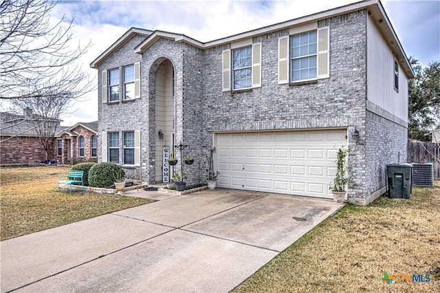 view of front of house featuring central AC unit, a garage, and a front lawn