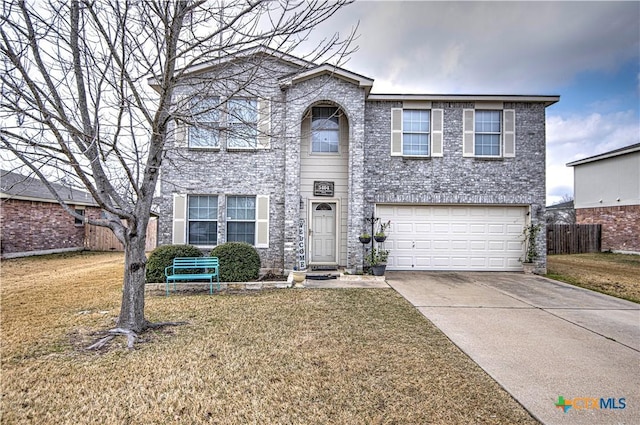 view of front property with a garage and a front lawn