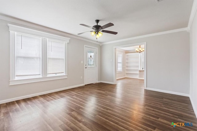 unfurnished room featuring crown molding, baseboards, and dark wood-type flooring