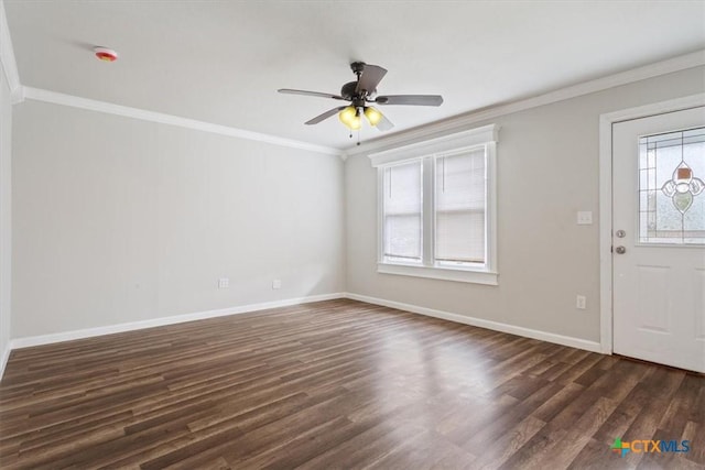 foyer featuring dark wood-style floors, crown molding, baseboards, and a ceiling fan