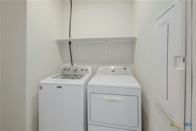 laundry area with washing machine and dryer