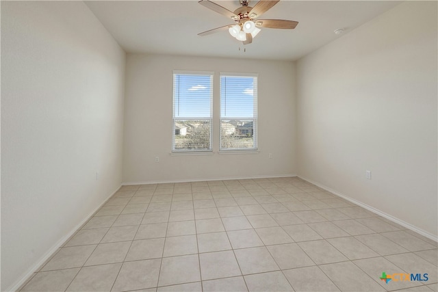 spare room with ceiling fan