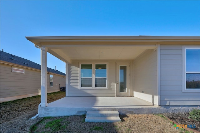 back of property with a patio area