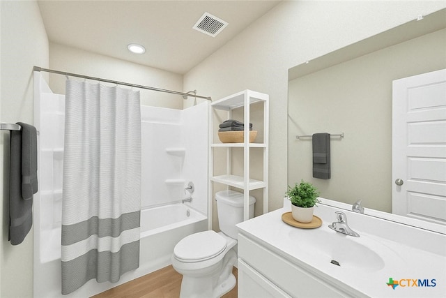 604 Cypress Arbor, Seguin, TX 78155 - bathroom with vanity, toilet, wood finished floors, shower / bath combination with curtain, and recessed lighting