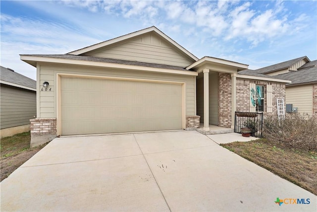 ranch-style house featuring a garage