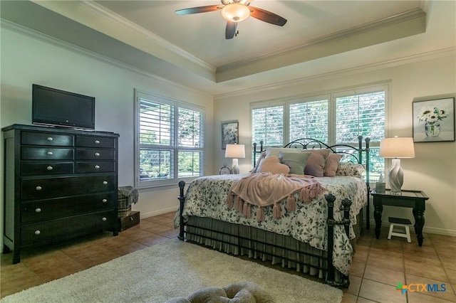 1320 Daisy Ln, Temple, TX 76502 - bedroom featuring a tray ceiling, tile patterned flooring, crown molding, and a ceiling fan