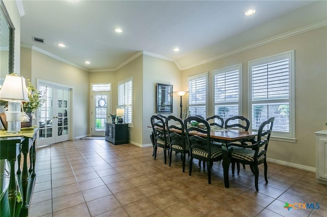 1320 Daisy Ln, Temple, TX 76502 - dining space with plenty of natural light, french doors, light tile patterned flooring, ornamental molding, and recessed lighting