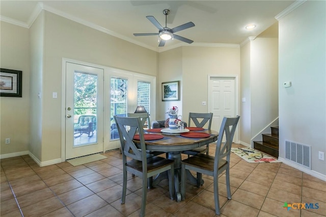 1320 Daisy Ln, Temple, TX 76502 - dining room featuring ceiling fan, stairway, light tile patterned floors, and ornamental molding