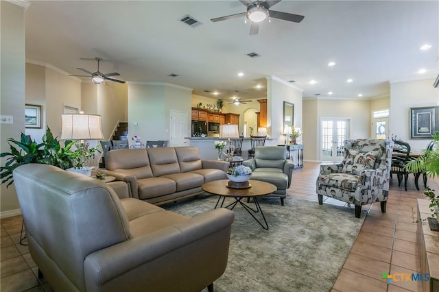 1320 Daisy Ln, Temple, TX 76502 - living area featuring ceiling fan, crown molding, stairs, light tile patterned floors, and recessed lighting