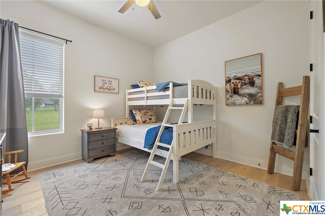 bedroom with ceiling fan and light hardwood / wood-style floors