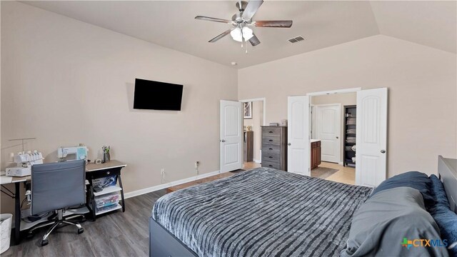 bedroom with baseboards, light wood-type flooring, vaulted ceiling, a ceiling fan, and visible vents