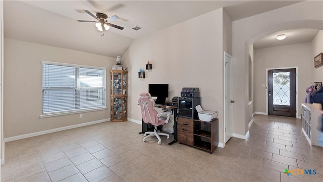 office space featuring visible vents, a wealth of natural light, a ceiling fan, and arched walkways