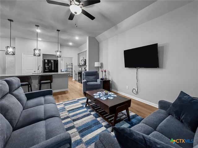 1525 Dryden Ave, Copperas Cove, TX 76522 - living area featuring light wood-type flooring, a ceiling fan, lofted ceiling, baseboards, and recessed lighting
