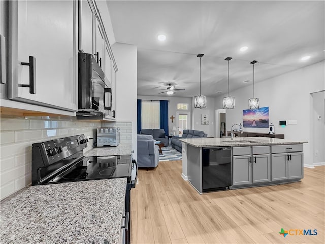1525 Dryden Ave, Copperas Cove, TX 76522 - kitchen featuring black appliances, open floor plan, a sink, ceiling fan, and recessed lighting