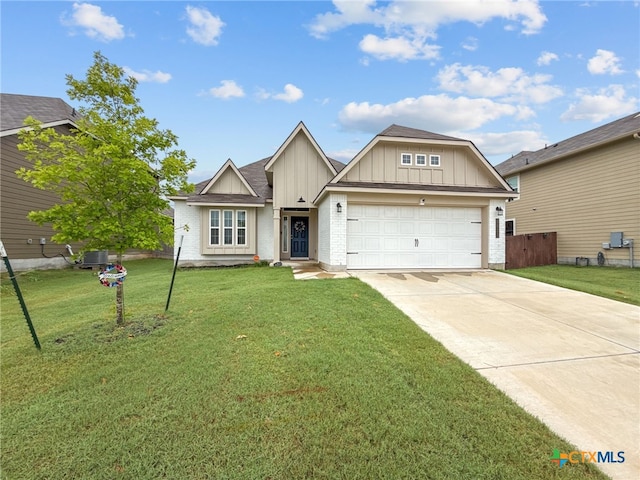 1525 Dryden Ave, Copperas Cove, TX 76522 - view of front facade with board and batten siding, driveway, and a garage