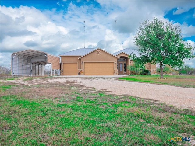 view of front of property with a front lawn, a garage, and a carport