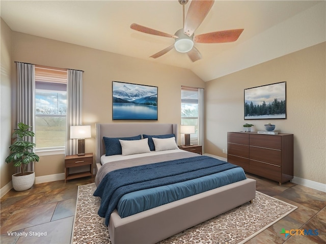 bedroom with multiple windows, vaulted ceiling, and ceiling fan