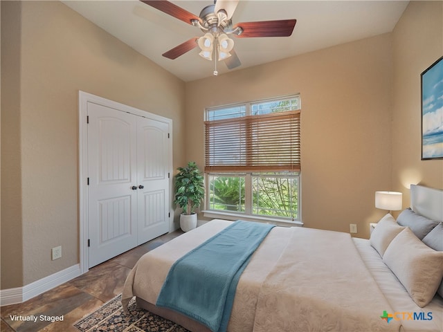 bedroom featuring a closet and ceiling fan