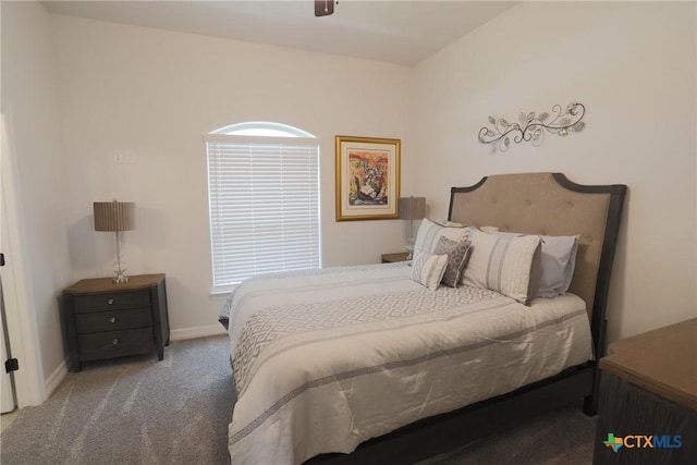 carpeted bedroom featuring a ceiling fan and baseboards