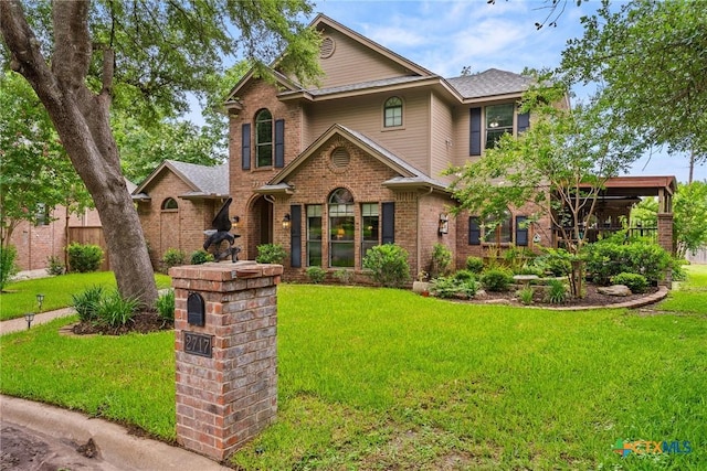 2717 Canyon Oaks Ct, Temple, TX 76502 - traditional-style house featuring a front lawn and brick siding