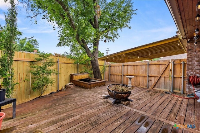 2717 Canyon Oaks Ct, Temple, TX 76502 - wooden deck featuring an outdoor fire pit and a fenced backyard