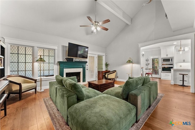 2717 Canyon Oaks Ct, Temple, TX 76502 - living area featuring ceiling fan, beam ceiling, light wood finished floors, a fireplace, and high vaulted ceiling