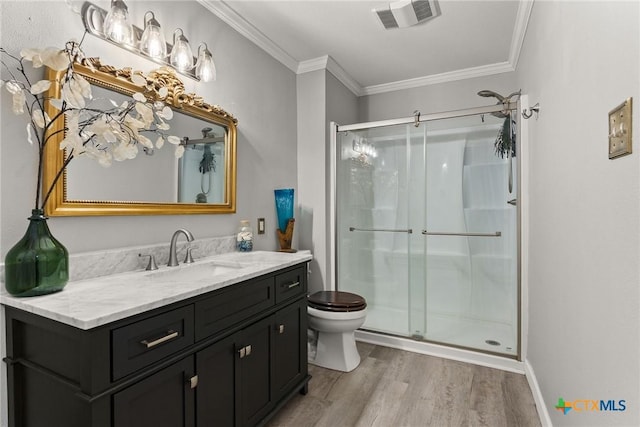 2717 Canyon Oaks Ct, Temple, TX 76502 - bathroom with wood finished floors, vanity, a stall shower, and ornamental molding
