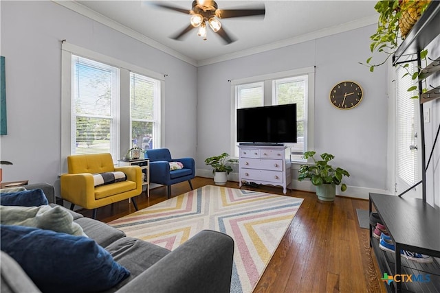 212 Whitfield St, Yoakum, TX 77995 - living room with plenty of natural light, ceiling fan, wood finished floors, ornamental molding, and baseboards
