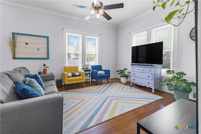 212 Whitfield St, Yoakum, TX 77995 - living area featuring wood finished floors, ceiling fan, and crown molding
