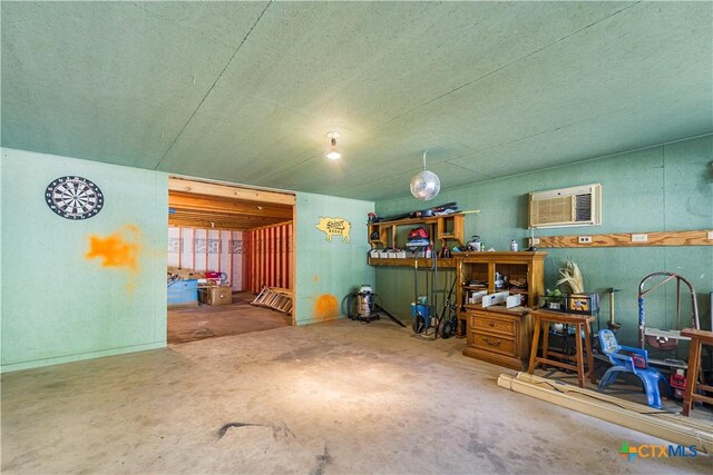 212 Whitfield St, Yoakum, TX 77995 - misc room with a wall mounted air conditioner and concrete floors